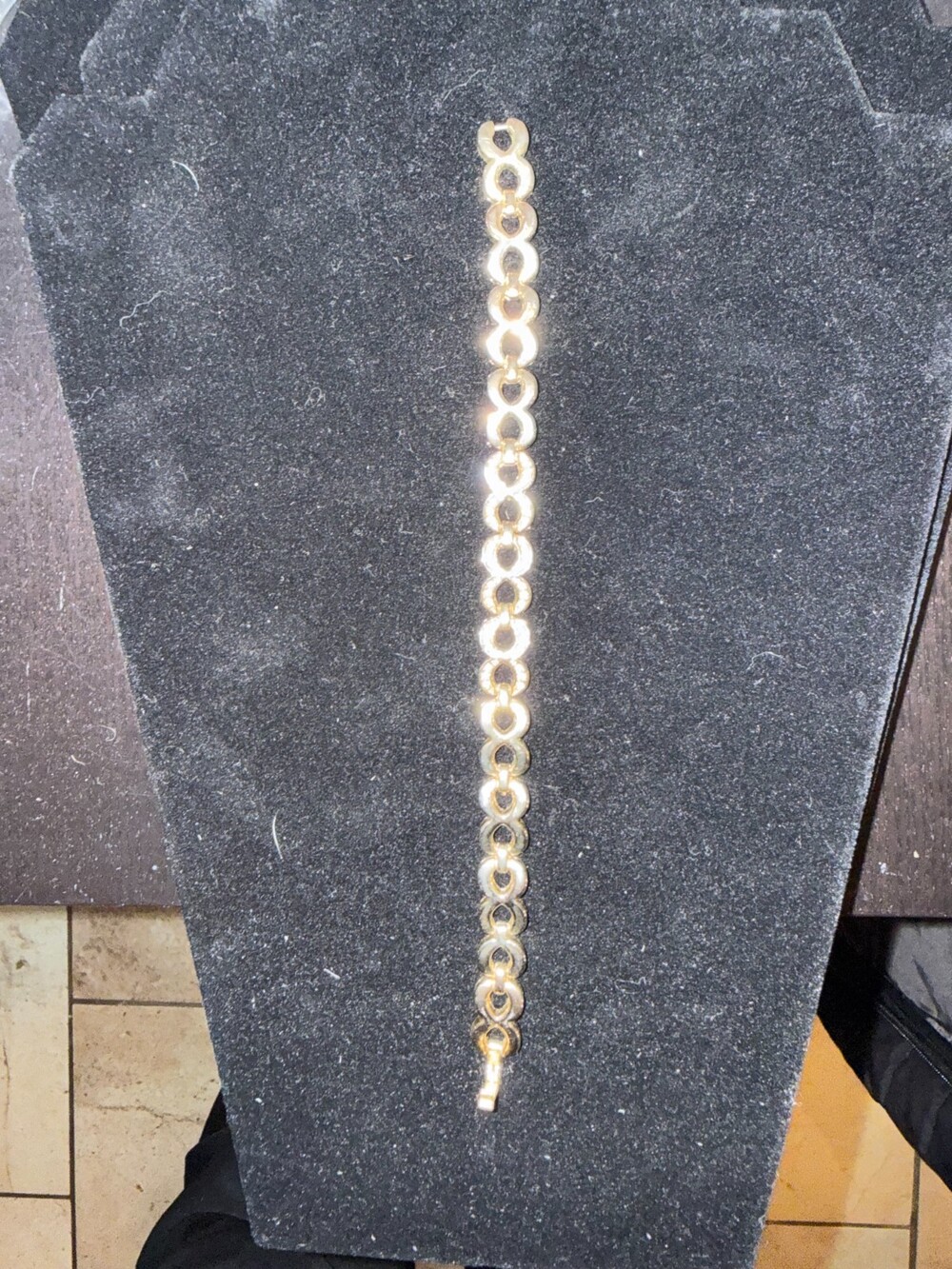 Gold tone chain link bracelet with clear rhinestones in some of the links